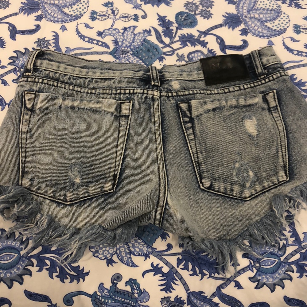 Distressed denim shorts
